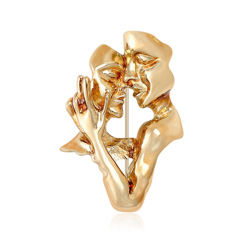 Gold abstract couple faces figure brooch front on white background