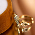 Gold Tone Knot Detail Crystal Accent Huggie Hoop Earrings view 5