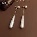Gold Tone Pearl Like Long Teardrop Chain Stud Earrings view 2