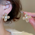 Gold Tone Crystal Petal Flower Stud Earrings With Pearl Centers view 2