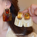 Gold Square Resin Drop Earrings in Amber and Ivory Tones view 1