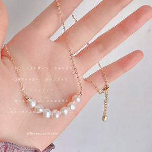 Gold Tone Chain Necklace With Graduated White Pearl Curved Centerpiece