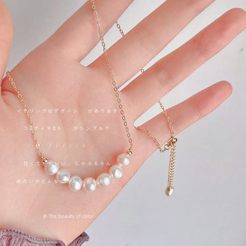 Gold Tone Chain Necklace With Graduated White Pearl Curved Centerpiece