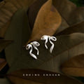 Silver Tone Flowing Ribbon Bow Sculptural Stud Earrings view 1