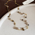 Layered Brown Bead Necklace with Gold Tone Chain Details view 6