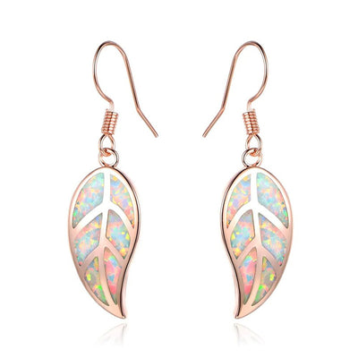 Rose gold leaf resin glitter hook dangle earrings on white background