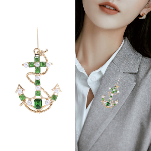Close-up product view showing the colors and surface details of the checkered enamel anchor brooch