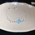 Silver Blue Butterfly Slider Bracelet and Flower Hoop Earrings view 6