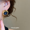 Deep Blue Faceted Stone Stud Earrings in Textured Gold Tone view 3