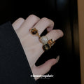 Three Mixed Statement Rings With Brown Crystals Green Or Brown Stones view 1