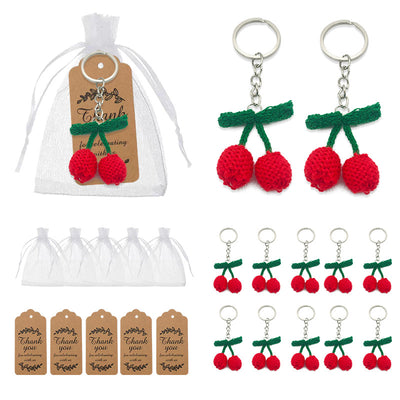 Cherry keychains displayed with white organza bags and brown thank-you tags.