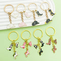 Western Cowboy Charm Keychains Featuring Black Boot Across 30 Pictured Variations view 1