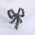 Filigree Rhinestone Bow Brooch Silver or Antique Gold view 2