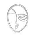 Abstract Single Line Face Brooch in an Oval Metal Frame view 2