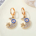 Gold Tone Ornate Crystal Evil Eye Huggie Drop Earrings in Seven Designs view 9