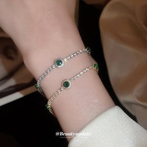 Silver Tone Clear Crystal Bracelet With Green Round Stone Accents