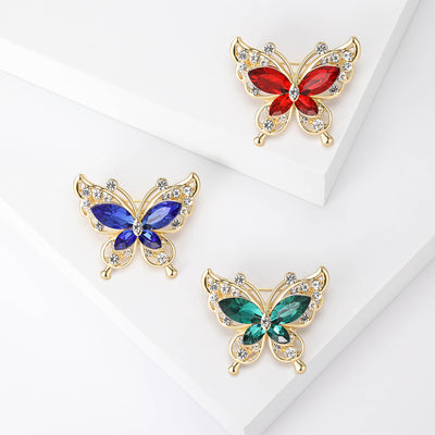 Gold Tone Butterfly Brooch shown alone on a light background