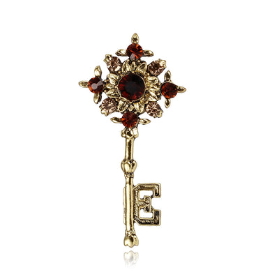 Front product view of the key brooch pin in gold and red