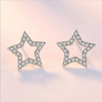 Silver Tone open star outline studs shown in front detail view