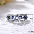 Round Clear Solitaire Split Band Ring With Blue Side Stones view 5