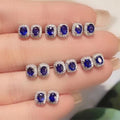 Royal Blue Oval Halo Stud Earrings Clear Stone Border view 1