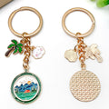 Four Green Camping Mountain and Palm Tree Metal Keychain Designs view 2