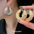 Sculpted Open Hoop Earrings In Gold And Silver Tones view 1