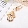 Gold and Silver Tone Owl and Hamsa Evil Eye Clip Keychains view 3