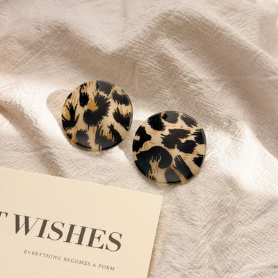 Primary supplied view of oversized round disc stud earrings
