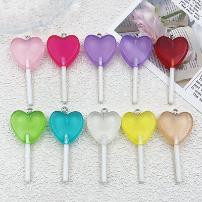 Printed detail graphic for the heart and lollipop charms