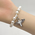 White Pearl Stretch Bracelet Winged Cross Charm Metal Charm view 3