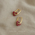 Gold-Tone Oval Huggie Red Open Heart Accent Earrings Pair view 1