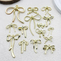 Metallic Bow and Butterfly Metal Charms with 19 Listed Options view 1