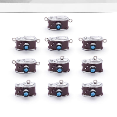 Multicolor headphone charms arranged on a light background