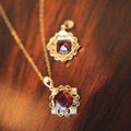 Gold Tone Red Stone Ornate Pendant Necklace with Polished Finish view 2