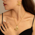 Gold Butterfly Pendant Necklace and Matching Earring Set view 1