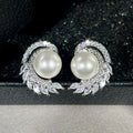Silver Tone Faux Pearl Stud Earrings with Leaf CZ Accents view 2