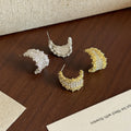 Gold and Silver Crystal Crescent Wide Huggie Earrings view 2
