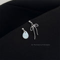 Asymmetric Silver Bow Shell Drop Earrings Mismatched Pair view 1