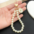 Pearl Loop Rose Medallion Bag Charms in White and Pink view 3