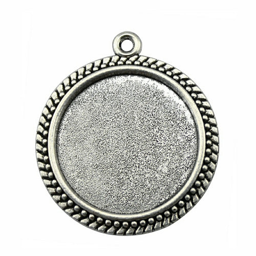 Close view of braided-rim round bezel pendant trays in two finishes