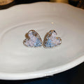 Silver Tone Heart Stud Earrings with Faceted Centers view 2