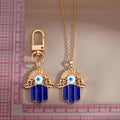 Gold and Silver Tone Open Hamsa Necklaces and Clip Keychains view 5