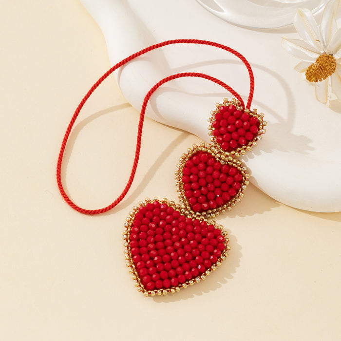 Beaded Red Heart Trio Pendant with Gold-Tone Trim and Red Cord
