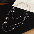 Silver Tone Layered Necklace with Stars and Floral Charms view 6