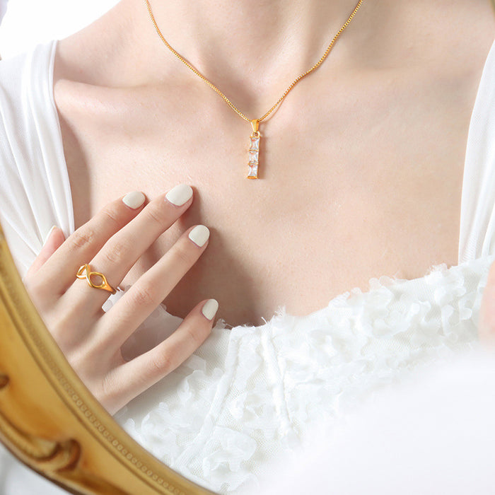 Gold Tone Three Stone Vertical Baguette Pendant Necklace