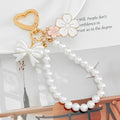Pearl Bead Wristlet Keychain with Bow and Sakura Flower Charms view 1