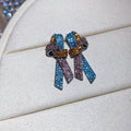 Crystal Bow Stud Earrings in Black or Multicolor Stripes view 7
