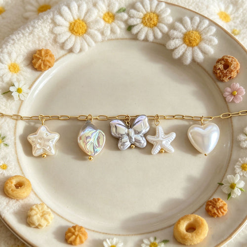 Alternate view showing the shape and hardware of the pictured pendants and clasps