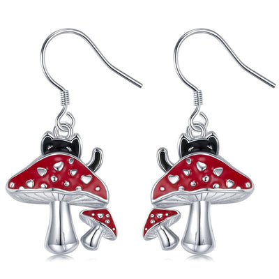 Silver red mushroom black cat drop earrings pair on white background